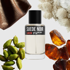 Suede Noir scent notes — black leather, cardamom, patchouli, ambered woods — Larcin
